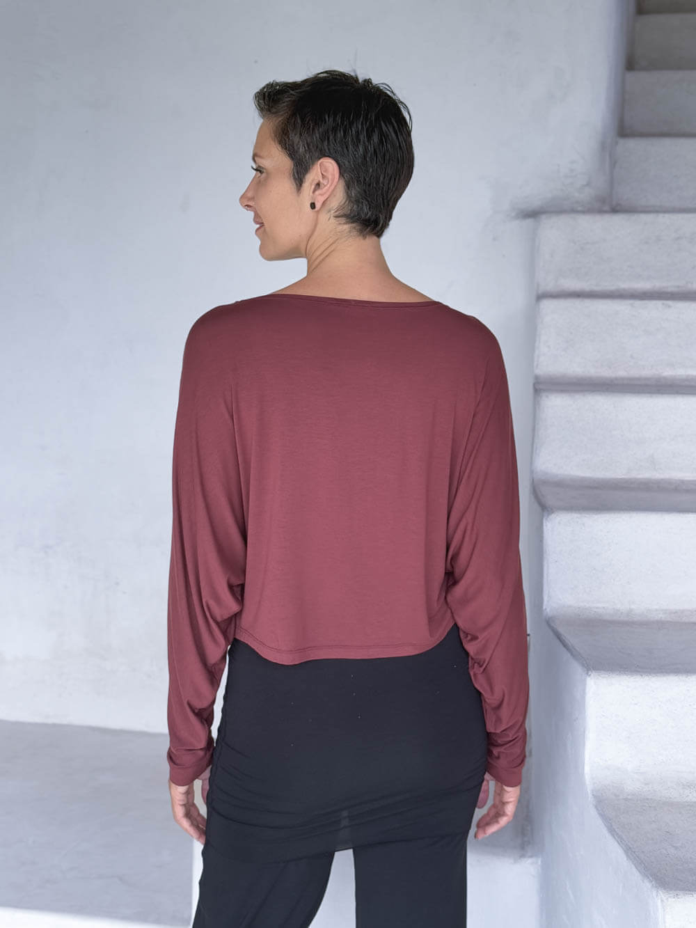 caraucci lightweight rayon jersey maroon long sleeve dolman top with black skirt over pants #color_wine