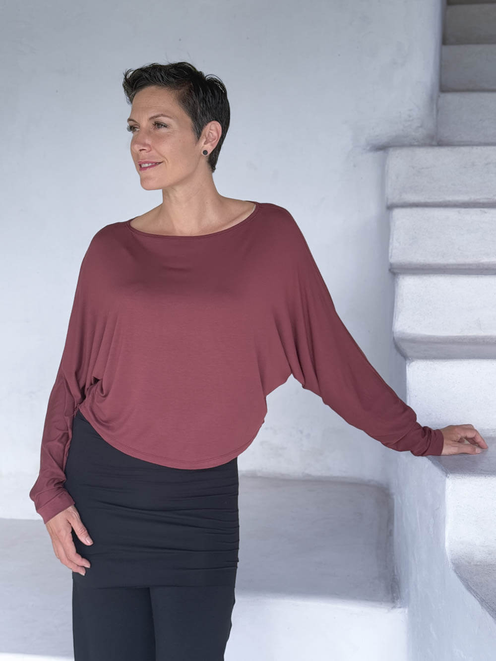 caraucci lightweight rayon jersey maroon long sleeve dolman top with black skirt over pants #color_wine