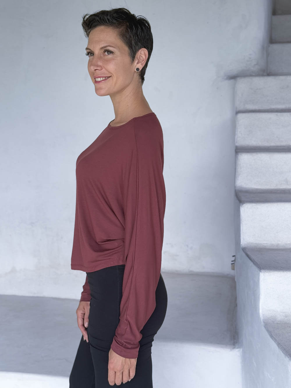 caraucci lightweight rayon jersey maroon long sleeve dolman top with black skirt over pants #color_wine