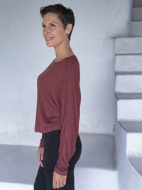 caraucci lightweight rayon jersey maroon long sleeve dolman top with black skirt over pants #color_wine