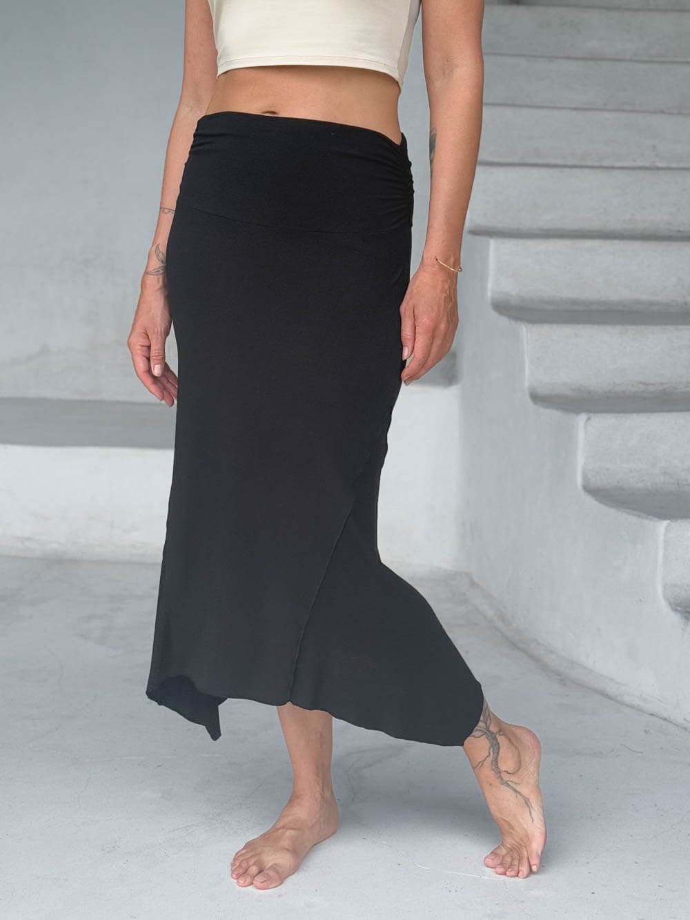 caraucci stretch rayon jersey asymmetrical black midi skirt #color_black