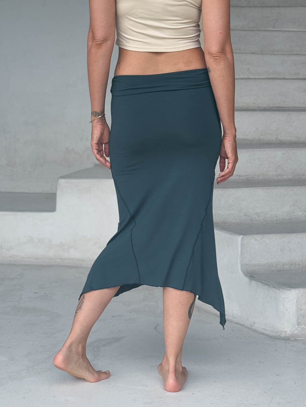 caraucci stretch rayon jersey asymmetrical teal blue midi skirt #color_teal