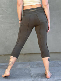 women's cotton lycra stretchy army green capri leggings with ruched knees and raised detail stitching #color_forest