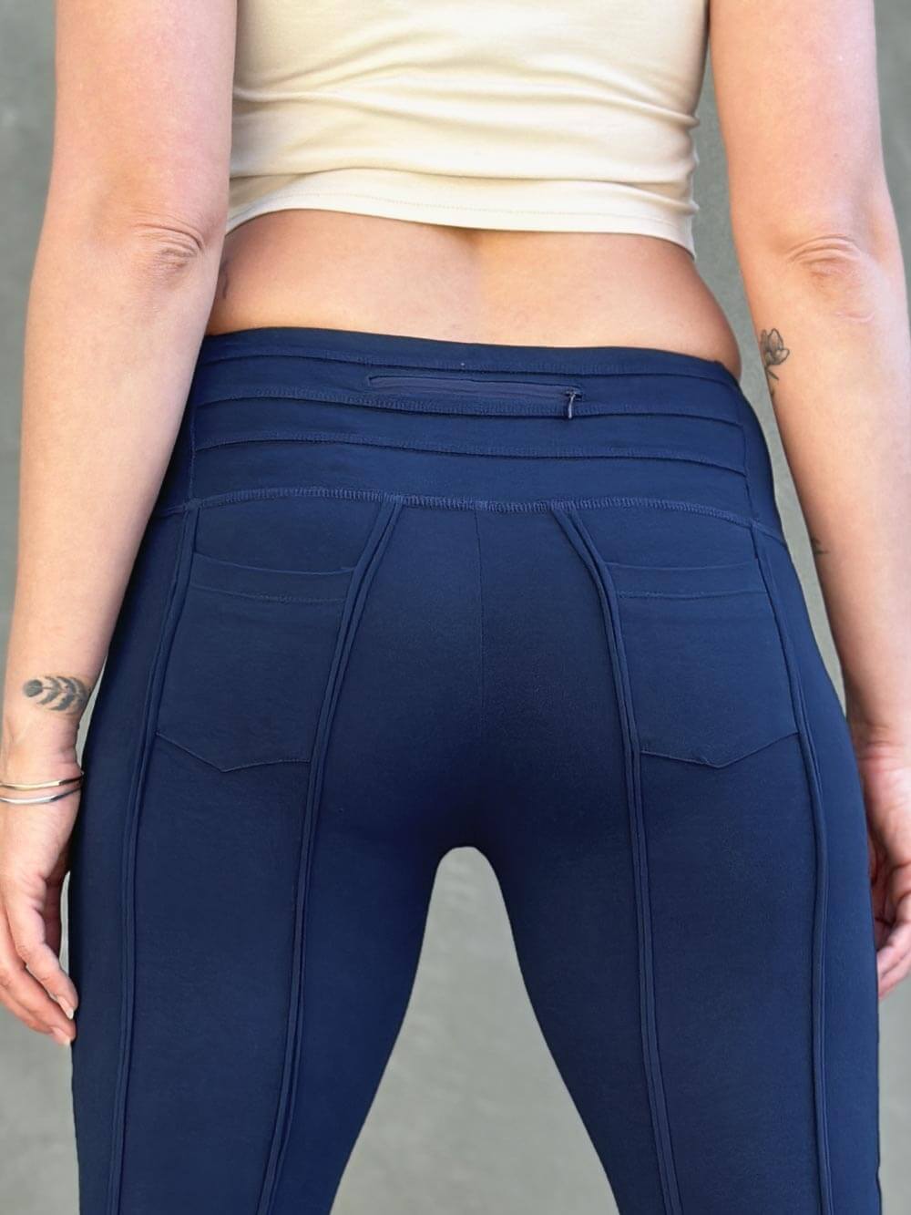 women's cotton lycra stretchy navy blue capri leggings with ruched knees and raised detail stitching #color_navy