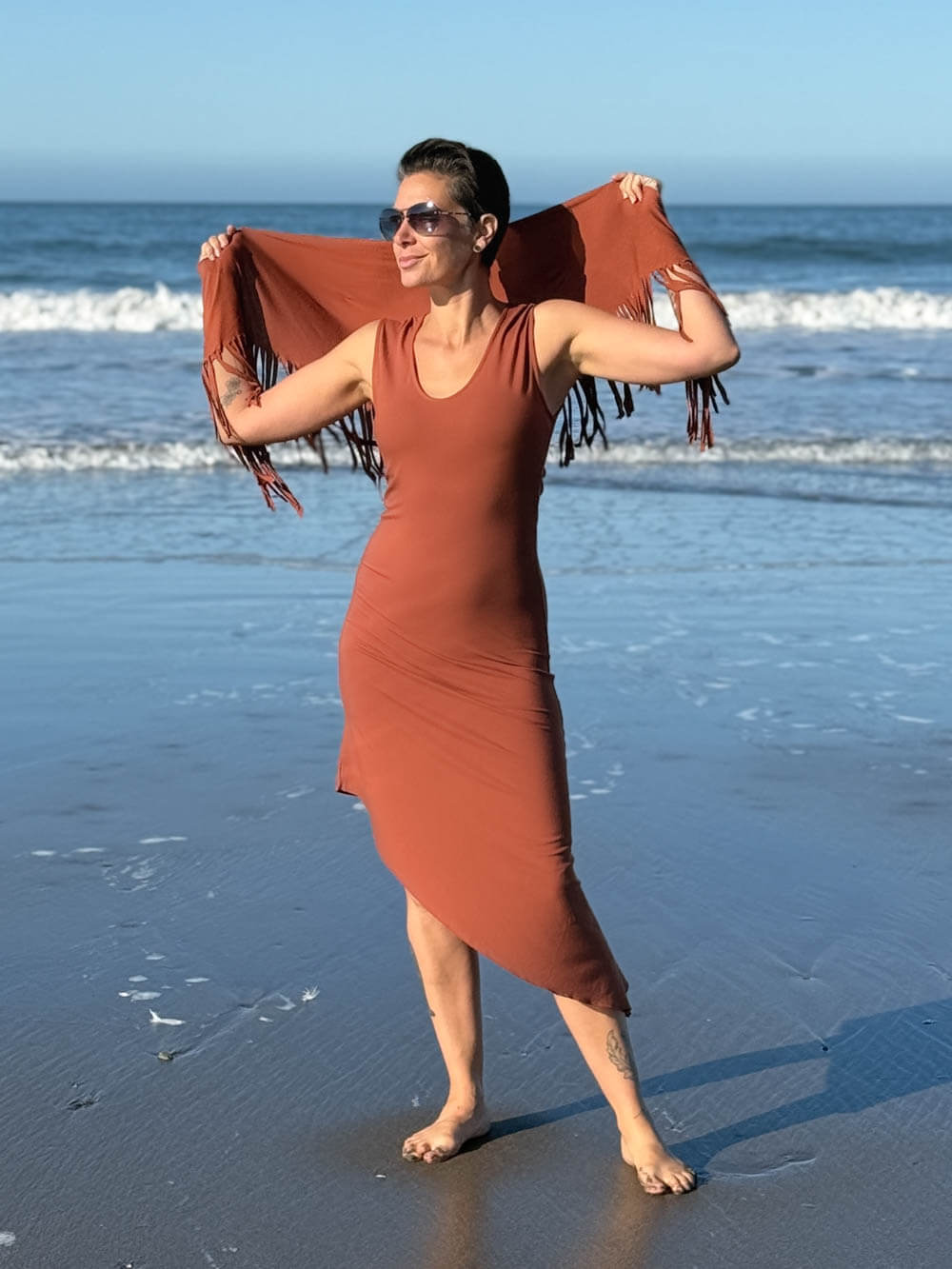 caraucci-fringe-scarf-orange-worn-as-shawl-over-black-dress #color_copper