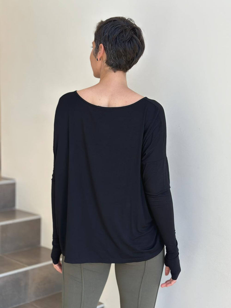 women's plant-based black relaxed fit jersey long sleeve top #color_black