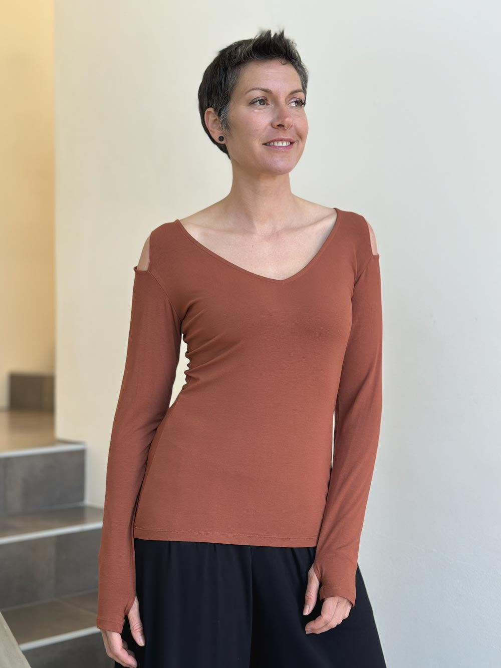 caraucci orange long sleeve cold shoulder top with thumbholes #color_copper