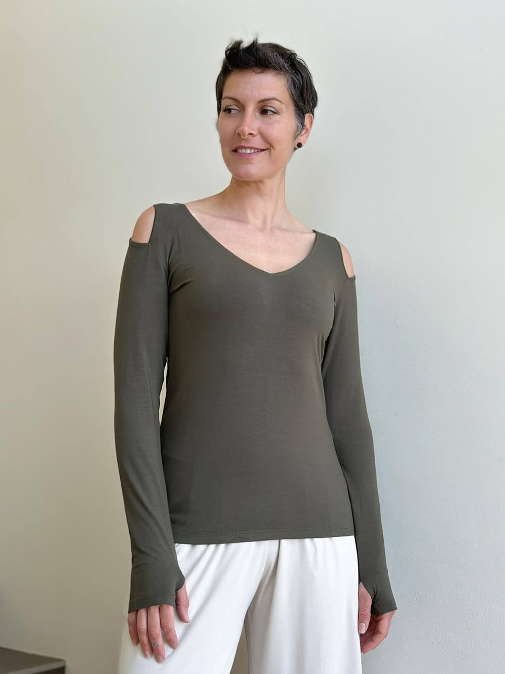 caraucci khaki green long sleeve cold shoulder top with thumbholes #color_forest