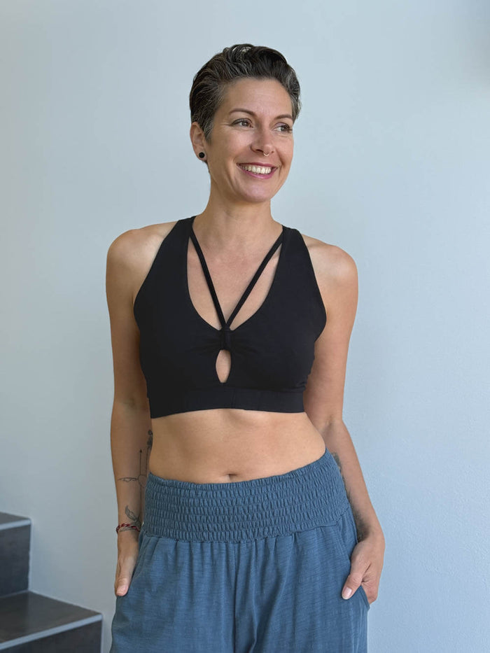 caraucci stretchy full coverage black yoga bra top with criss cross back straps #color_black