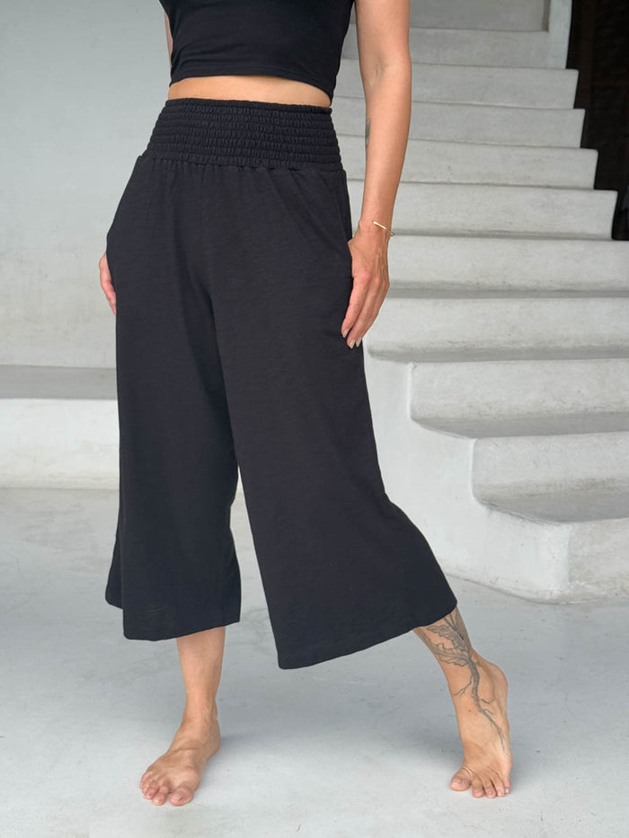 caraucci-cropped-wide-leg-black-cotton-pants-with-back-hem-slit-and-side-pockets #color_black