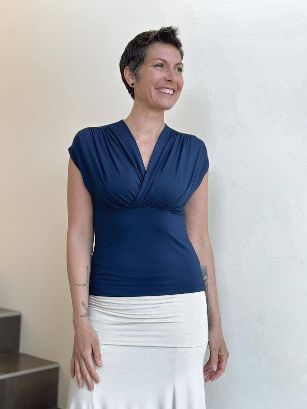 caraucci plant-based rayon stretch jersey navy blue cross over neckline top #color_navy