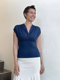 caraucci plant-based rayon stretch jersey navy blue cross over neckline top #color_navy