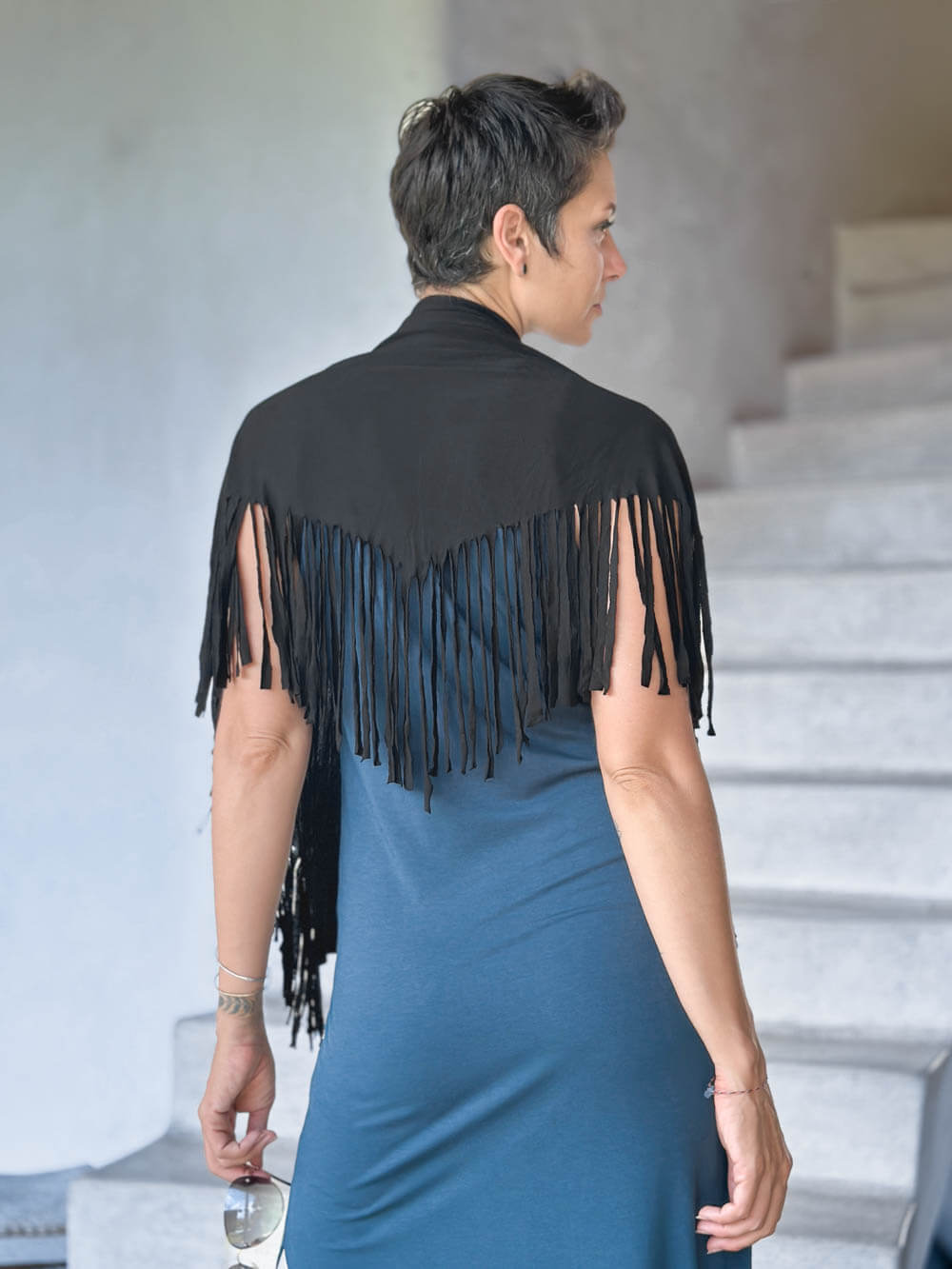 caraucci-black-fringe-scarf-worn-as-a-shawl-over-teal-dress #color_black