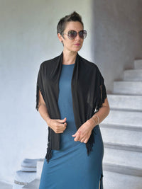 caraucci-black-fringe-scarf-worn-as-a-shawl-over-teal-dress #color_black