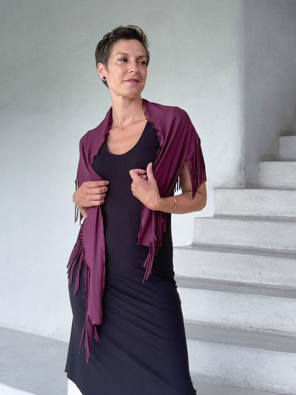 caraucci-fringe-scarf-jam-worn-as-shawl-over-black-dress #color_jam