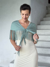 caraucci-fringe-scarf-sage-green-worn-as-shawl-over-cream-dress #color_moss