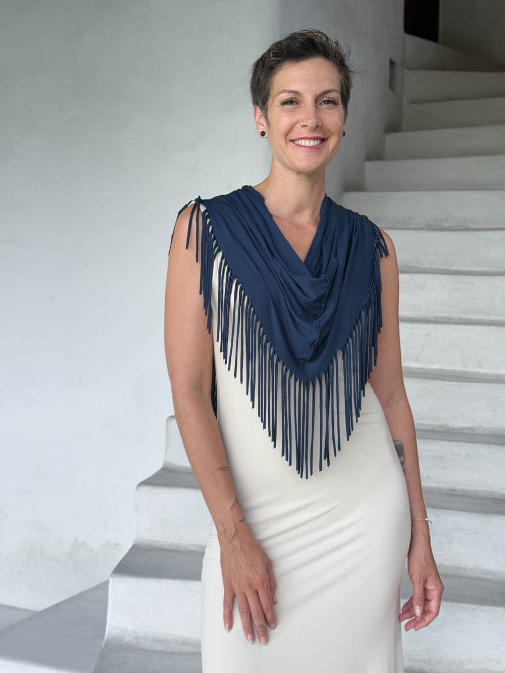 caraucci-navy-fringe-scarf-navy-worn-over-cream-dress #color_navy