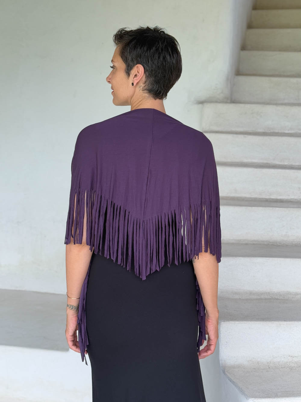 caraucci-fringe-scarf-plum-worn-as-shawl-over-black-dress #color_plum