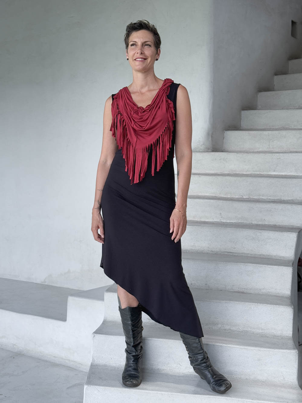 caraucci-fringe-scarf-red-worn-as-shawl-over-black-dress #color_scarlet