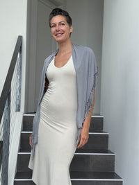 caraucci light grey fringe scarf worn as a shawl #color_stone