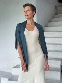 caraucci-fringe-scarf-teal-worn-as-shawl-over-cream-dress #color_teal