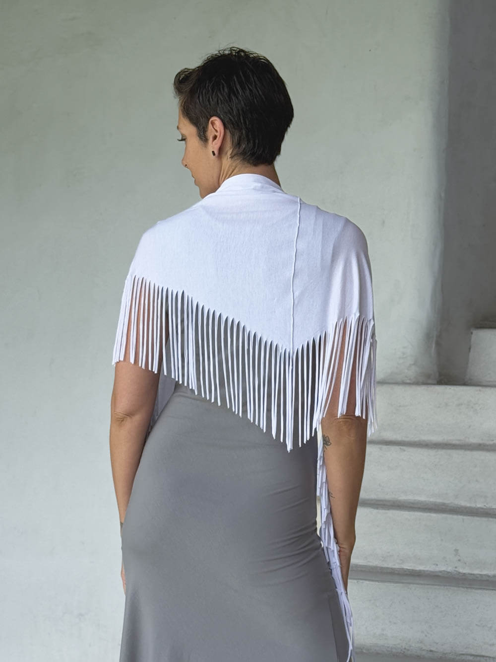 caraucci-fringe-scarf-white-worn-as-shawl-over-stone-dress #color_white