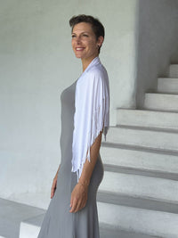 caraucci-fringe-scarf-white-worn-as-shawl-over-stone-dress #color_white