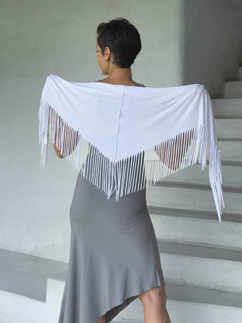 caraucci-fringe-scarf-white-worn-as-shawl-over-stone-dress #color_white