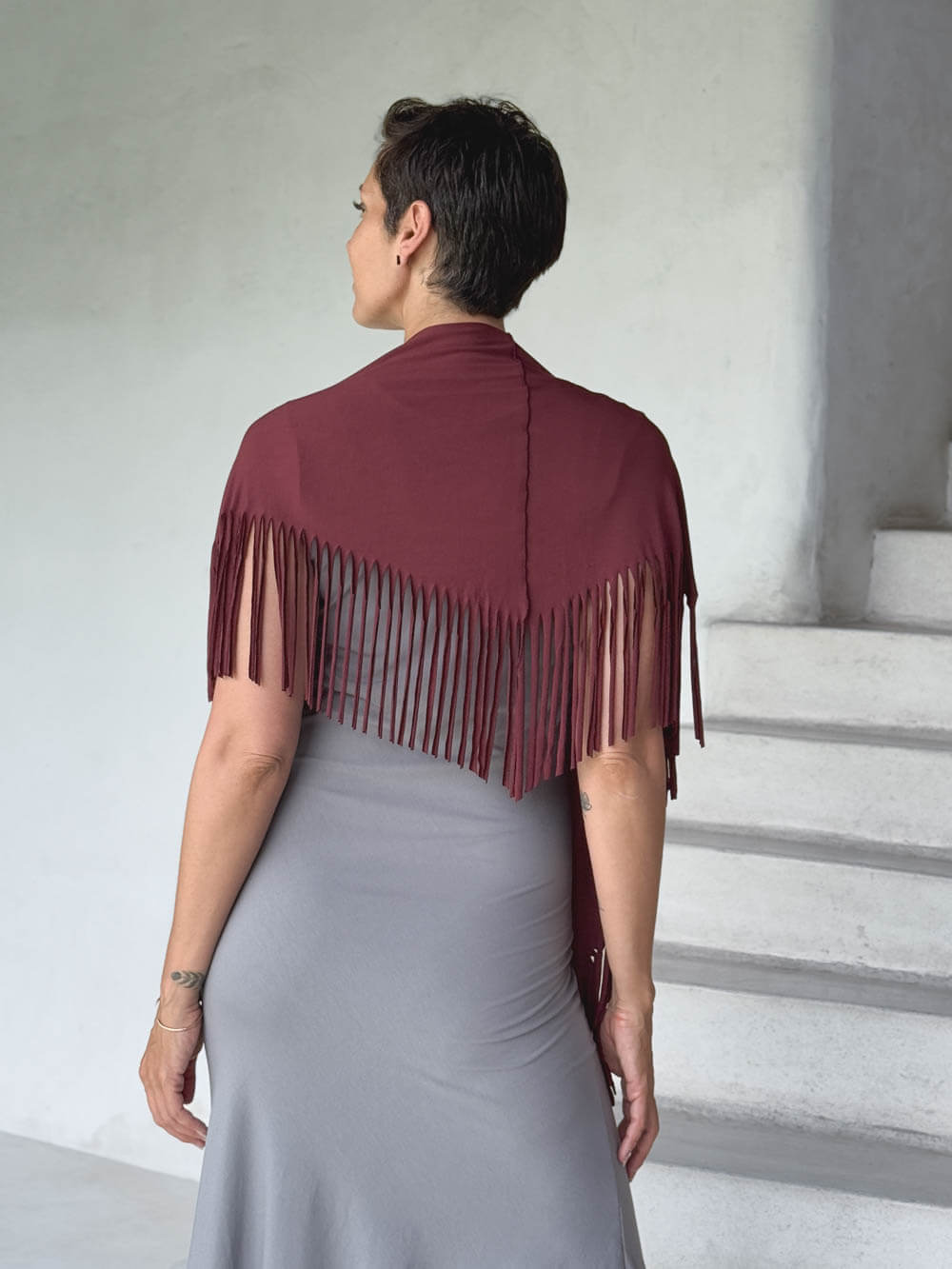 caraucci-fringe-scarf-maroon-worn-as-shawl-over-stone-dress #color_wine