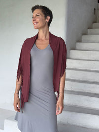 caraucci-fringe-scarf-maroon-worn-as-shawl-over-stone-dress #color_wine