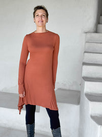 caraucci high neck orange high neck long sleeve swing tunic with thumbholes #color_copper