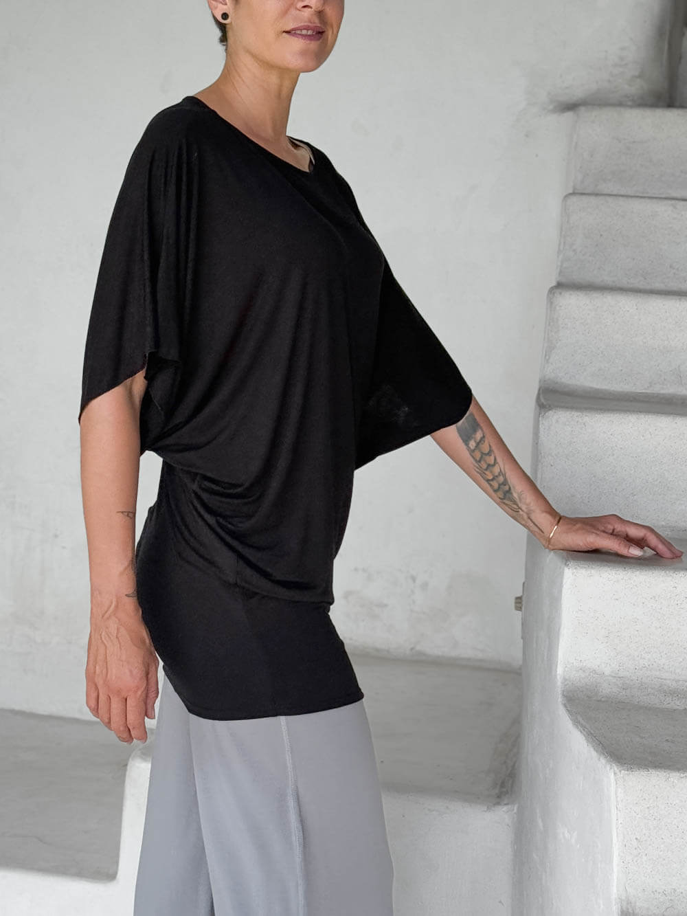 caraucci black kimono tunic worn as a tunic with stone pants #color_black