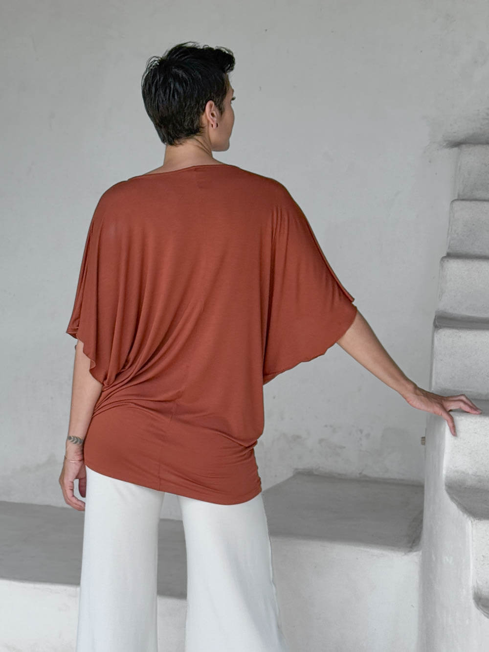 caraucci copper kimono tunic worn as a tunic with cream pants #color_copper