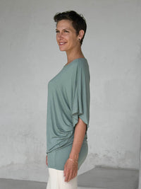 caraucci moss kimono tunic worn as a tunic with cream pants #color_moss