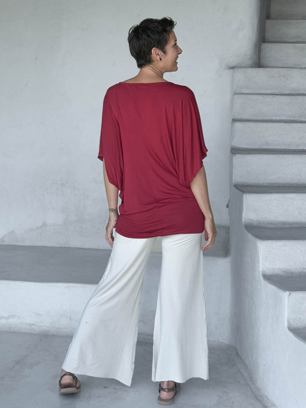 caraucci red kimono tunic worn as a tunic with cream pants #color_scarlet