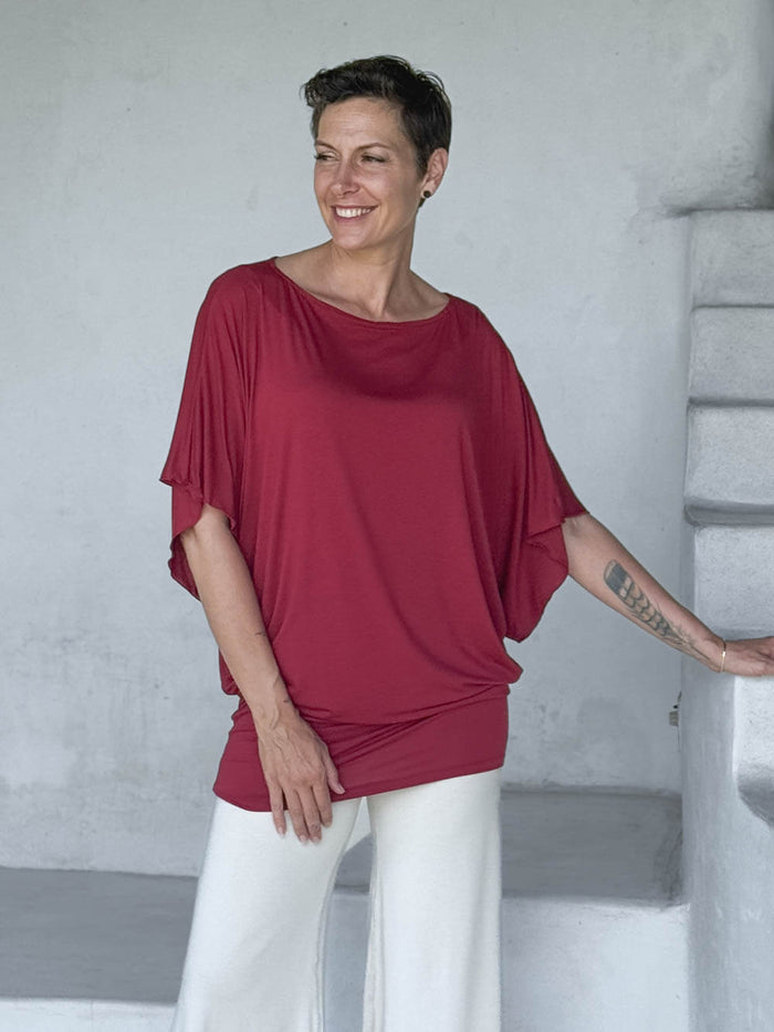 caraucci red kimono tunic worn as a tunic with cream pants #color_scarlet