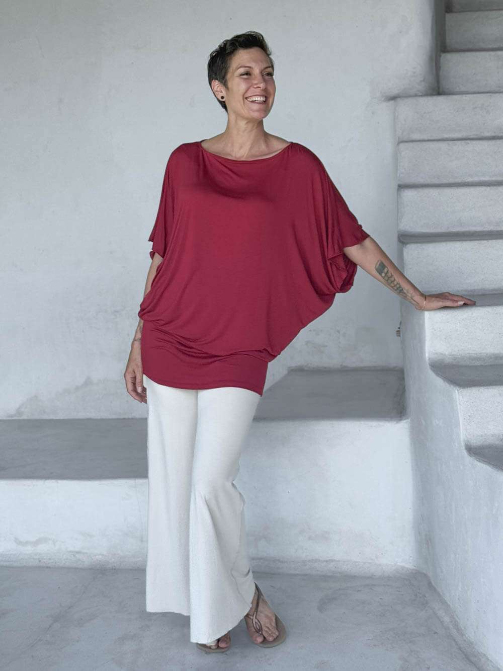caraucci red kimono tunic worn as a tunic with cream pants #color_scarlet