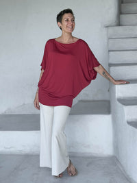 caraucci red kimono tunic worn as a tunic with cream pants #color_scarlet