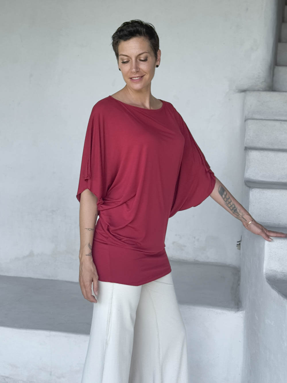 caraucci red kimono tunic worn as a tunic with cream pants #color_scarlet