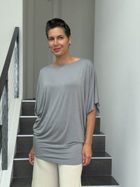 caraucci gray dolman sleeve draped tunic worn as a tunic with cream pants #color_stone