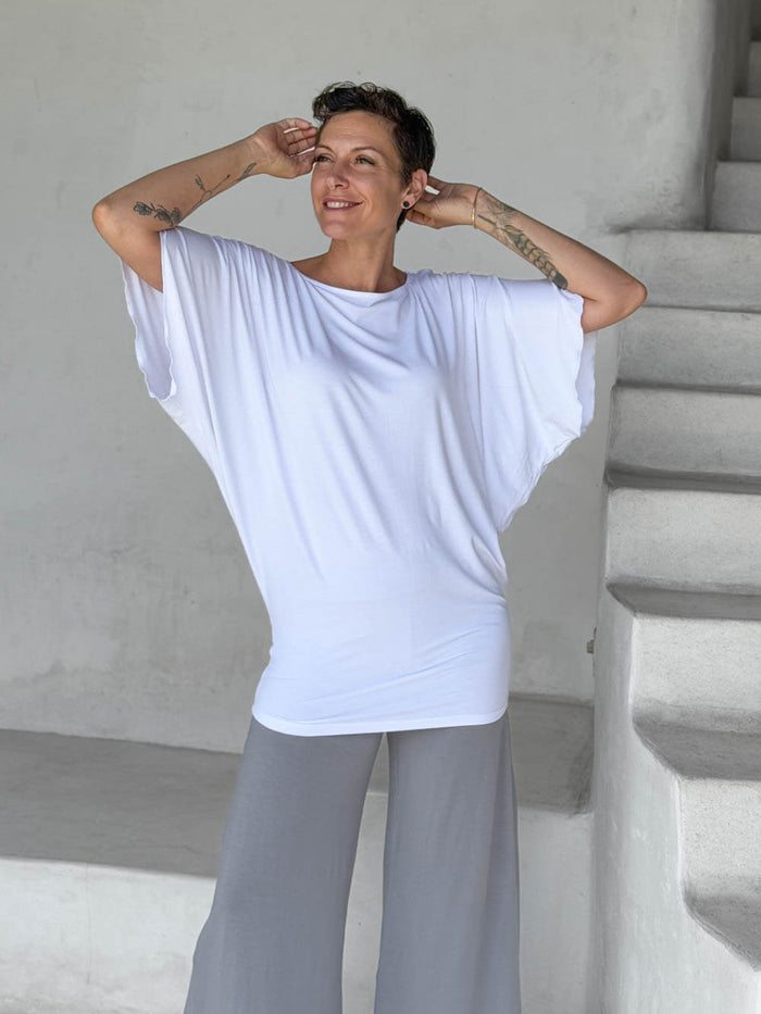 caraucci white kimono tunic worn as a tunic with stone pants #color_white