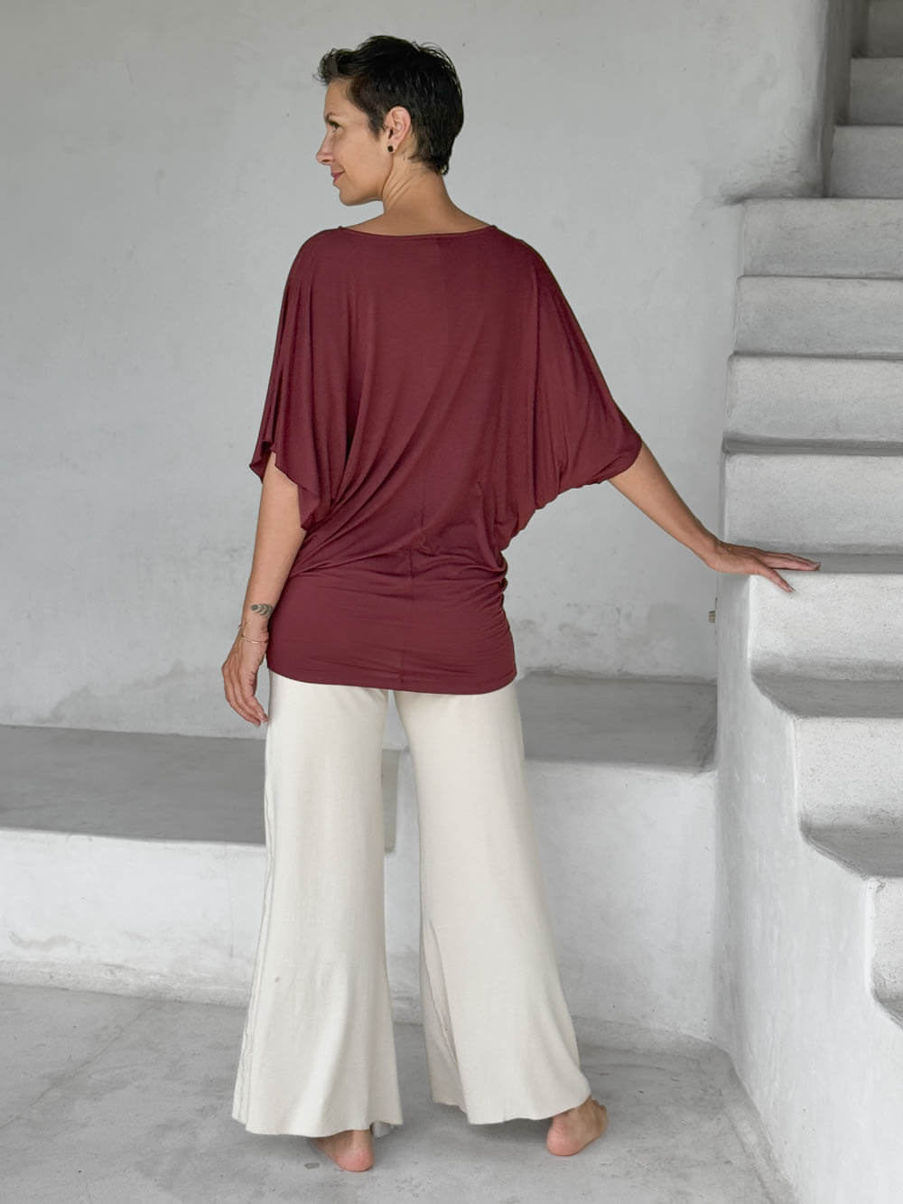 caraucci maroon kimono tunic worn as a tunic with cream pants #color_wine