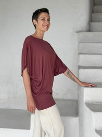 caraucci maroon kimono tunic worn as a tunic with cream pants #color_wine