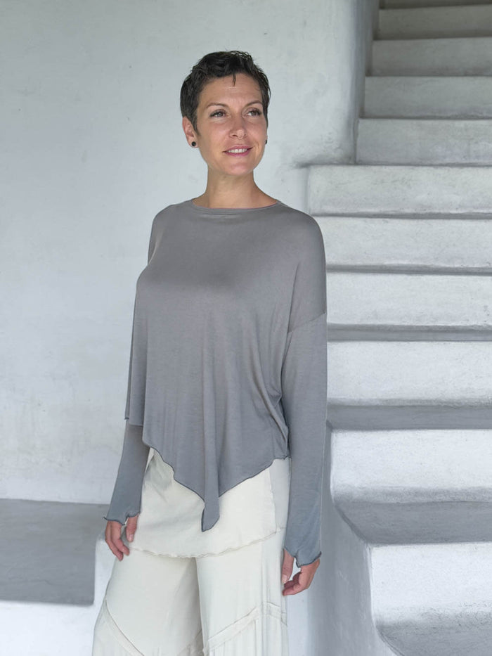 caraucci light gray long sleeve round neck asymmetrical top #color_stone