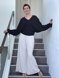 caraucci long sleeve black cotton v neck dolman long sleeve top #color_black