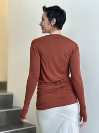 women's plant based rayon jersey lightweight long sleeve pumpkin orange top with thumbholes #color_copper