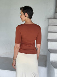 caraucci jersey round neck fitted short sleeve orange top #color_copper