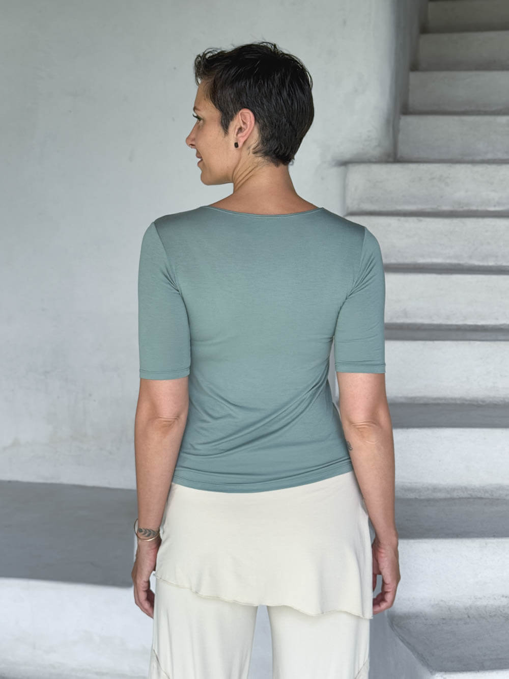 caraucci jersey round neck fitted short sleeve sage green top back view #color_moss