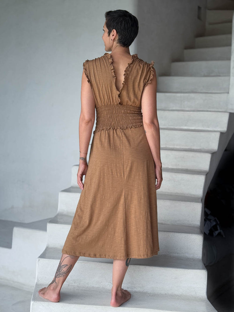 caraucci camel midi-length dress with smocked waist and sleeveless ruffled neckline and pockets #color_camel