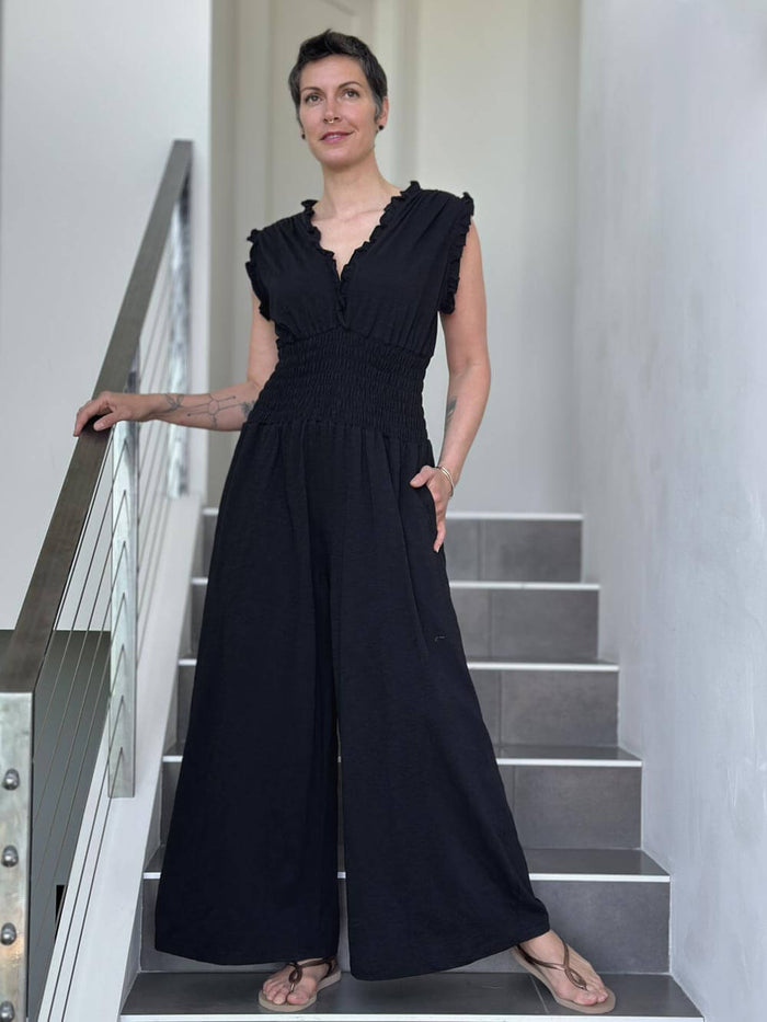 caraucci black cotton one piece ruffle pantsuit with smocked waistband #color_black